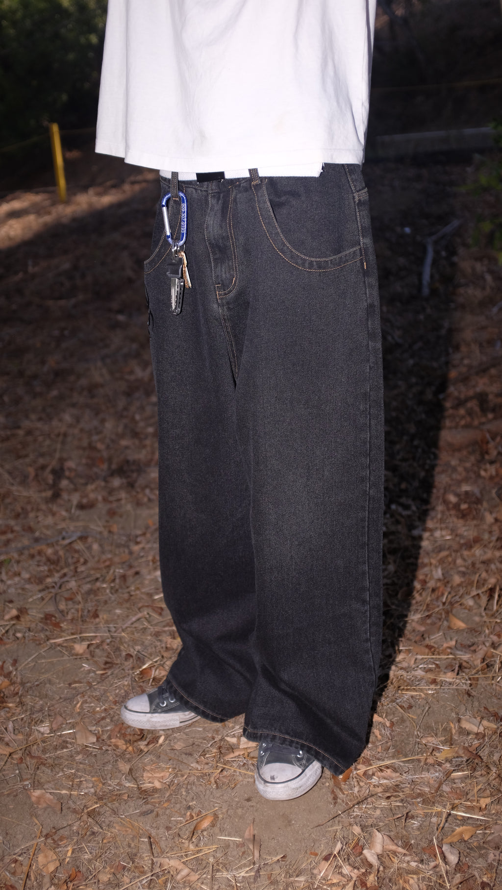 black cross jeans rust stitching