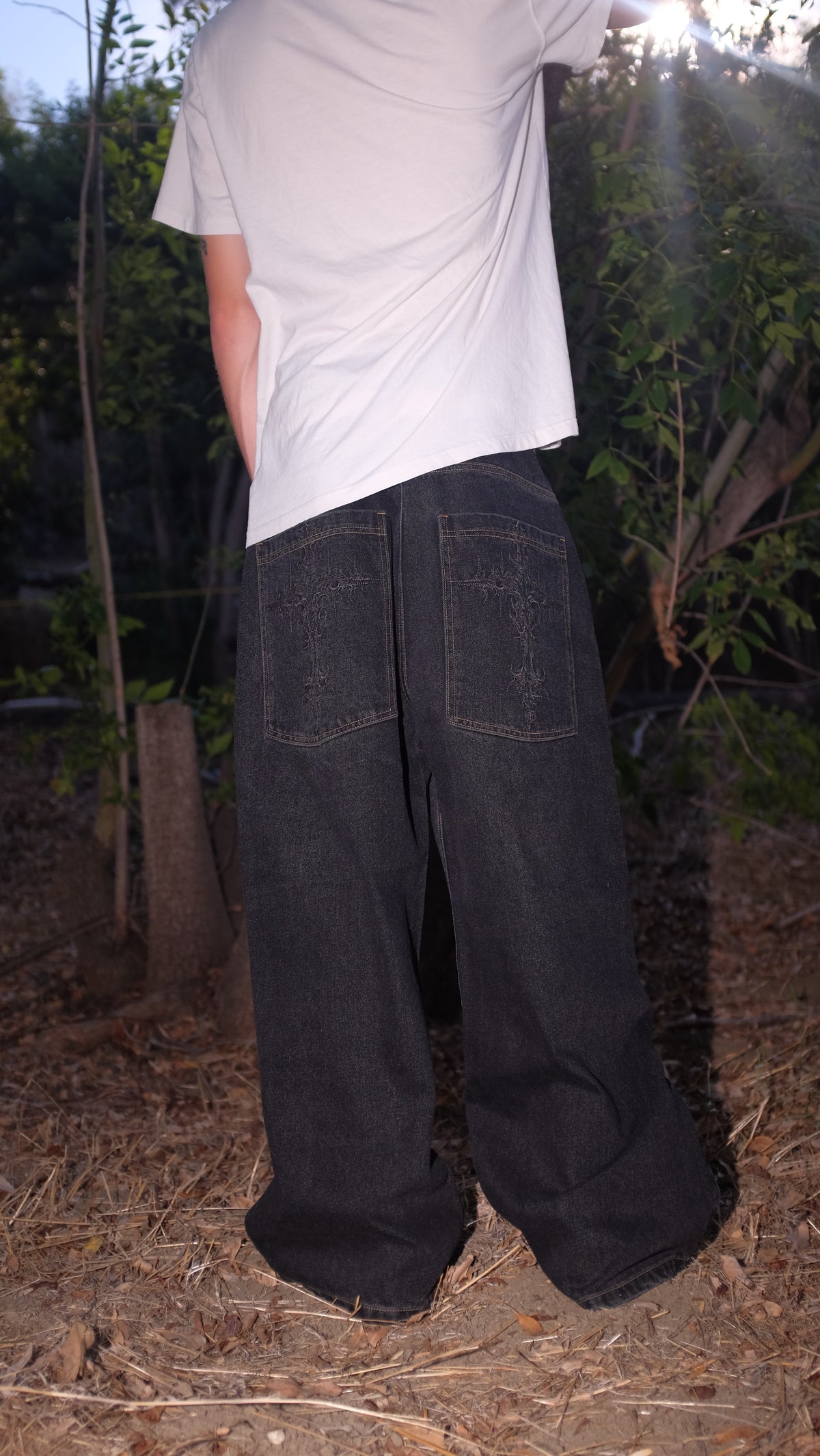 black cross jeans rust stitching